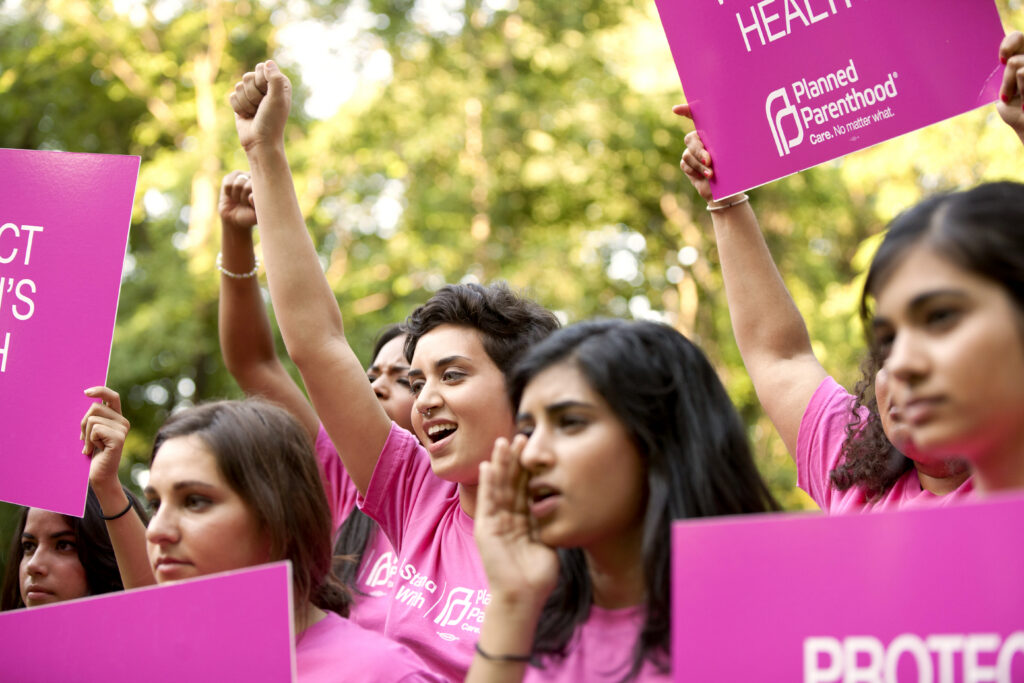 Reproductive rights advocates holding signs